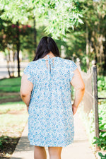misty bd tiered pocket dress in blue and teal small floral on white base plus size back view
