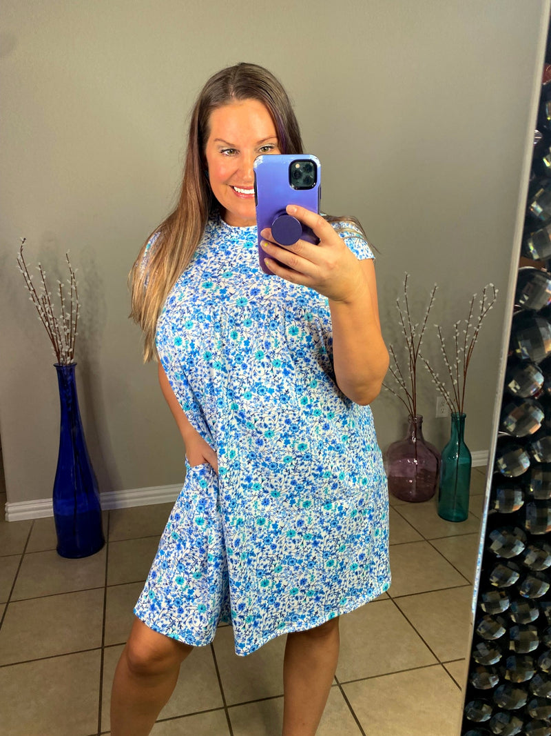misty bd tiered pocket dress in blue and teal small floral on white base selfie