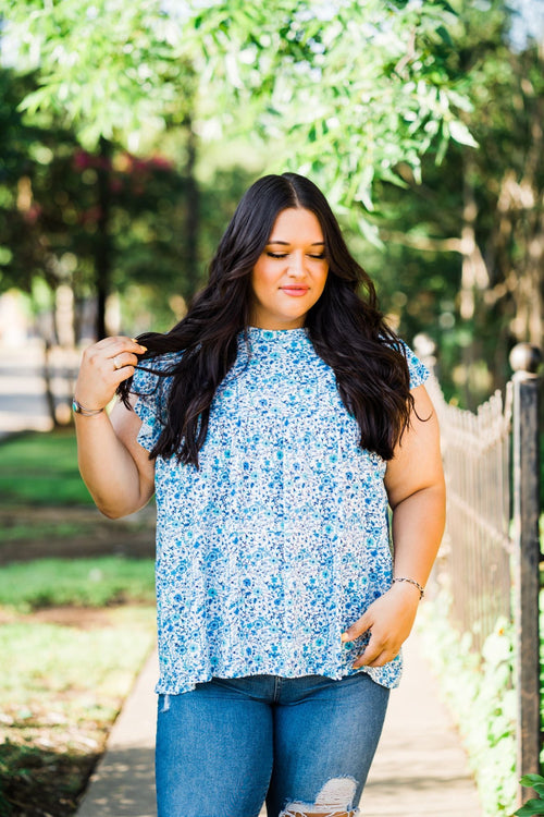 tiered ruffle sleeve top in blue and teal small on white base floral front view plus size model
