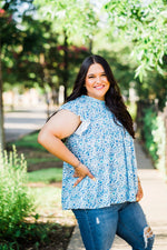 tiered ruffle sleeve top in blue and teal small on white base floral plus size side view